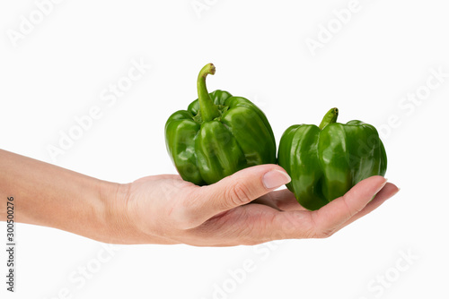 closeup of holding two fresh green pepper in hand with white background photo