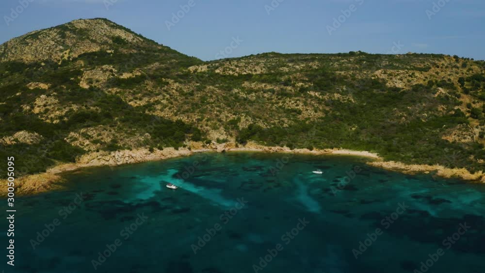 Aerial, beautiful seascape in Sardinia, Italy, turquoise water and little boat Aerial, beautiful seascape in Sardinia, Italy, turquoise water and little boat