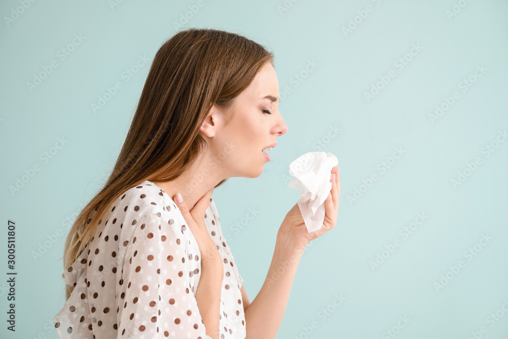 Young woman suffering from allergy on light background Young woman suffering from allergy on light background