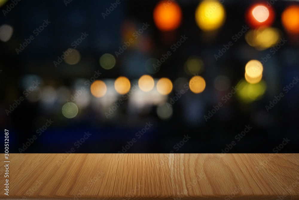 Empty dark wooden table in front of abstract blurred bokeh background of restaurant . can be used for display or montage your products.Mock up for space. Empty dark wooden table in front of abstract blurred bokeh background of restaurant . can be used for display or montage your products.Mock up for space.