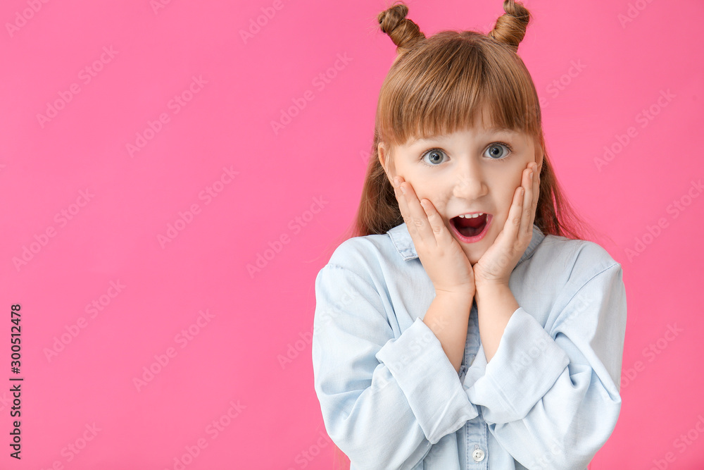 Surprised little girl on color background Surprised little girl on color background