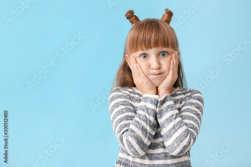 Surprised little girl on co...