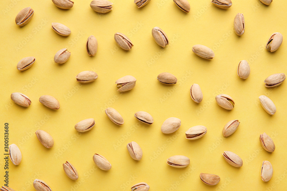 Tasty pistachio nuts on color background Tasty pistachio nuts on color background