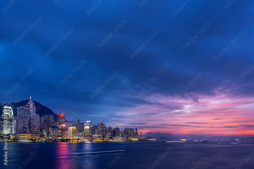 Cityscape and skyline at Victoria Harbour in Hong Kong city at Sunset