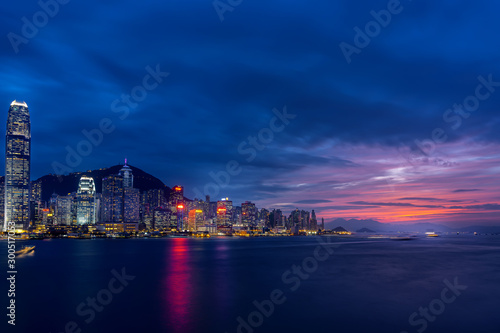 Cityscape and skyline at Victoria Harbour in Hong Kong city at Sunset