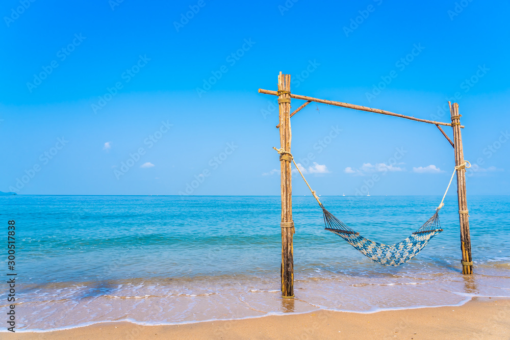 Empty hammock swing on the beautiful beach and sea Empty hammock swing on the beautiful beach and sea