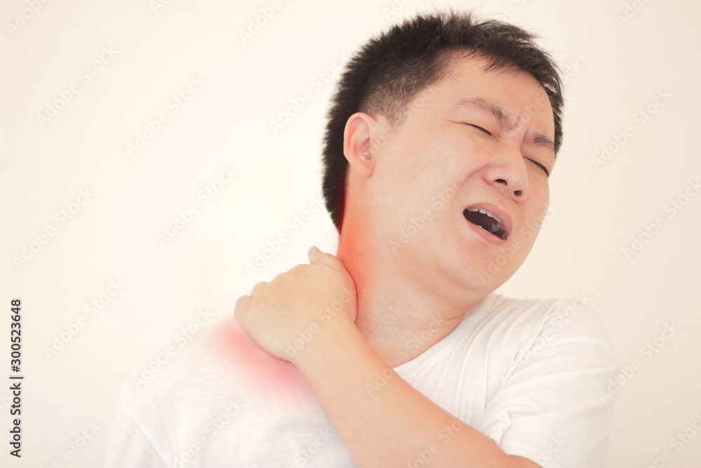 Young man with pain in shoulder, Ache in human body , office syndrome ,Concept healthcare and medical. Young man with pain in shoulder, Ache in human body , office syndrome ,Concept healthcare and medical.