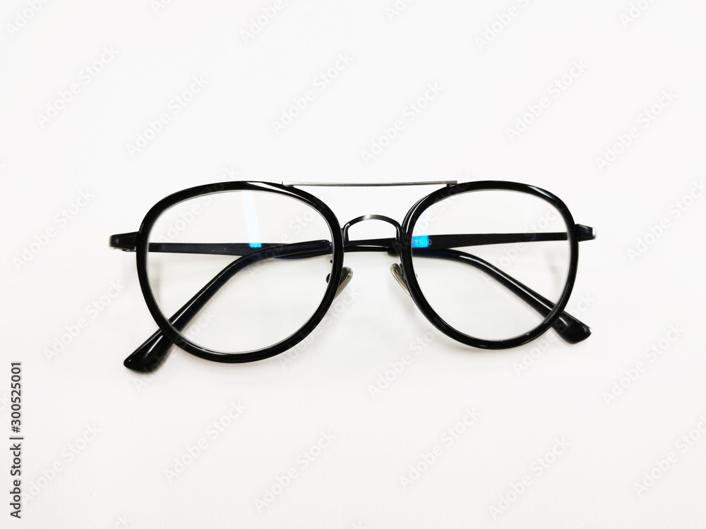 Black plastic eyeglasses frames with clear lens isolated on white background. Retro optical frame. Round vintage eye glasses frame. Black plastic eyeglasses frames with clear lens isolated on white background. Retro optical frame. Round vintage eye glasses frame.