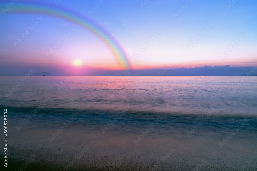 Sky sunset and ocean beach with rainbow