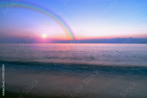 Sky sunset and ocean beach with rainbow © sirawut