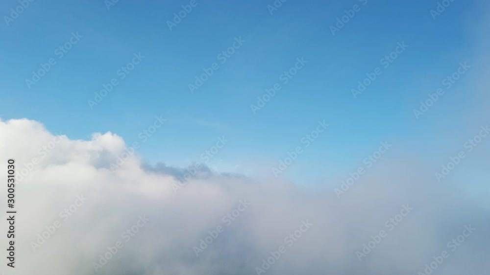 Flying through the clouds above mountain tops. Mountains wonderful evening sunset natural Landscape. Flying through the clouds above mountain tops. Mountains wonderful evening sunset natural Landscape.