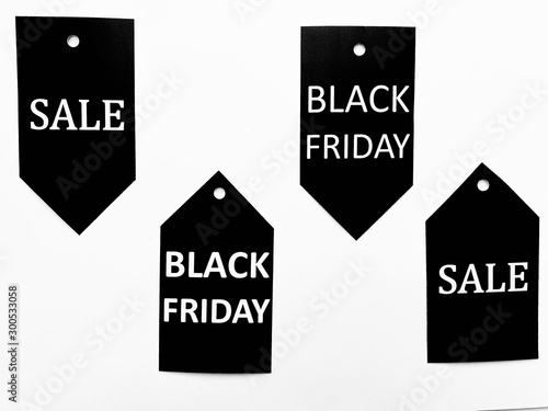 English white letters on black paper  Shapes of the price tag on white background Show sale at the end of the season or year  Black Friday  or the Gift Festival for family or lover at window display