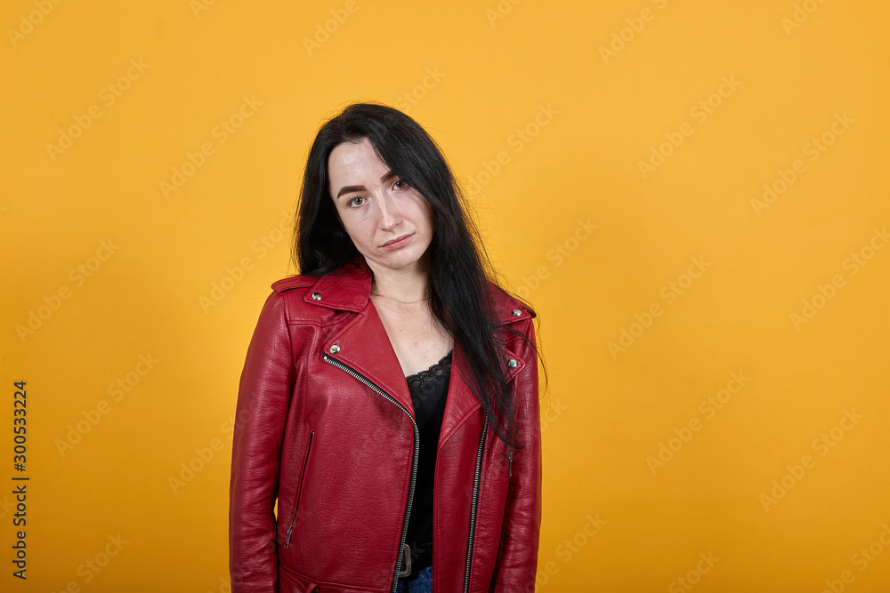 Portrait of offended displeased young girl in casual clothes standing, blowing lips isolated on wall background in studio. People sincere emotions, lifestyle concept. Portrait of offended displeased young girl in casual clothes standing, blowing lips isolated on wall background in studio. People sincere emotions, lifestyle concept.