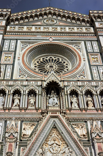 Detail of the facade of the Basilica di Santa Maria del Fiore (Florence Cathedral or Cathedral of Saint Mary of the flower), the main church of Florence, Italy. Bottom view.