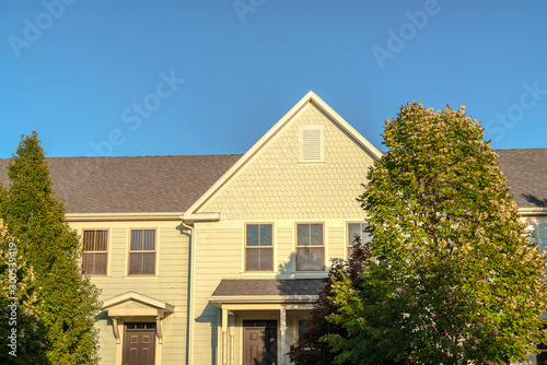 Facade of a large yellow house in evening light