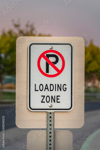 No Parking sign for vehicles for a Loading Zone