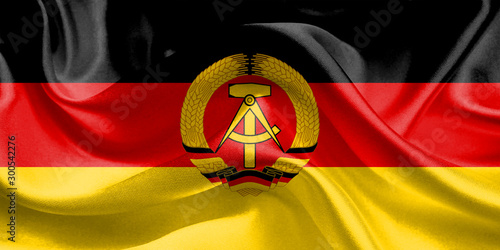 East Germany Flag. Flag of East Germany Waving Flags. 3D Realistic Background Illustration in Silk Fabric Texture photo