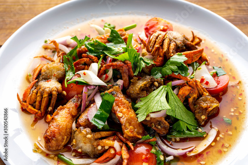 yum , salad,Three Crispy Salad, spicy salad ,Deep-fried shrimp head and fried crab to make salad.