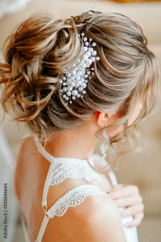 evening hairstyle with a beautiful hairpin, rear view