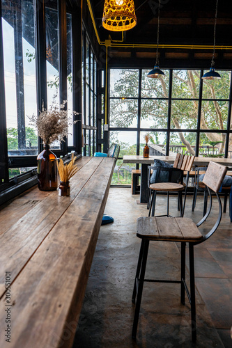  The atmosphere in the cafe is comfortable. ,Interior of cozy restaurant. Contemporary design in loft style, modern dining place and bar counter, copy space