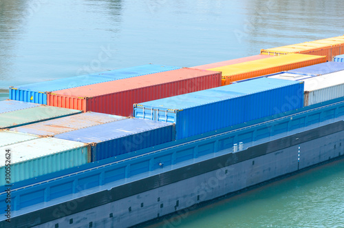 Foto Close up on freight containers on a ship or barge