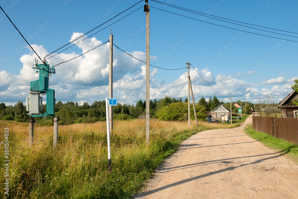 Electricity transformer substation mounted on the side of a country road in the village Electricity transformer substation mounted on the side of a country road in the village
