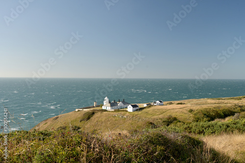 Lighthouse beside the coastal path near Durlston Castle on the Dorset coast © davidyoung11111