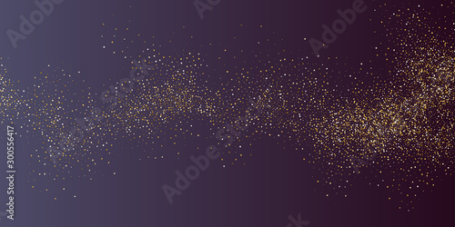 Gold glitter. Shiny particles on a dark background.
