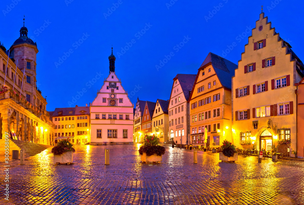 Main square (Marktplatz or Market square) of medieval German town of Rothenburg ob der Tauber evening panoramic view.
