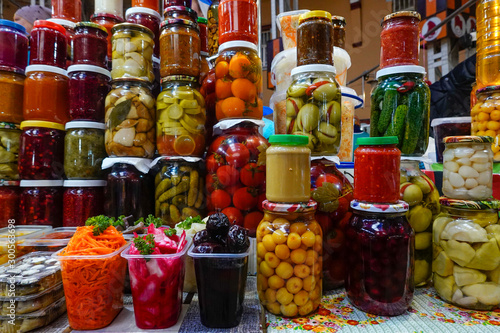 Kiev, UkraineConserved and preserved vegetables in jars at an indoor market.