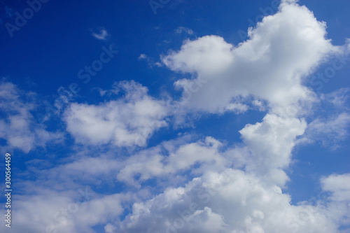 white clouds and blue sky on sunny summer autumn background © workingascene