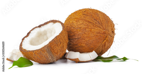 Cracked coconut with leaves isolated on white background