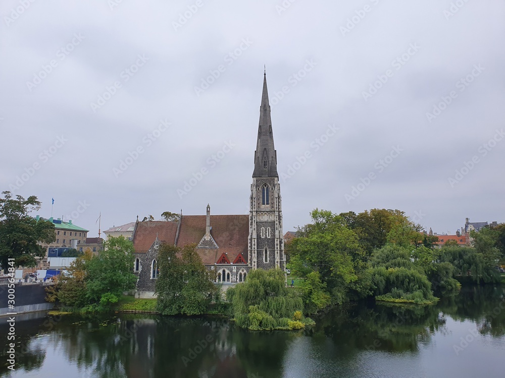 Old church along a river with reflection Old church along a river with reflection