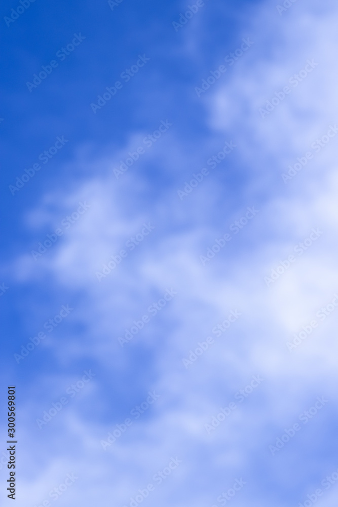 Abstract blurred background Blue sky with white clouds in sunlight. Abstract blurred background Blue sky with white clouds in sunlight.