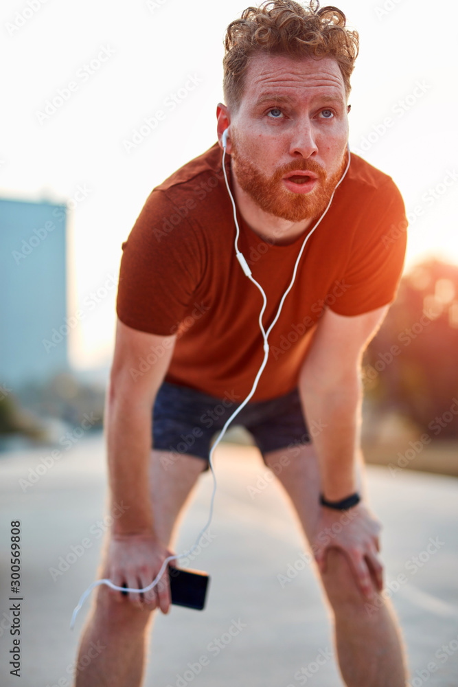 Fototapeta premium Modern young man working out in an urban park.