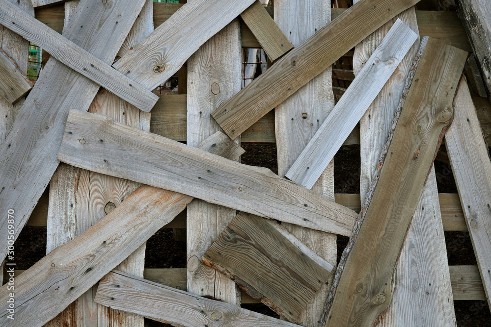 Construction jumble abstract background. Pile of boards scattered and mixed. Close-up. Construction jumble abstract background. Pile of boards scattered and mixed. Close-up.