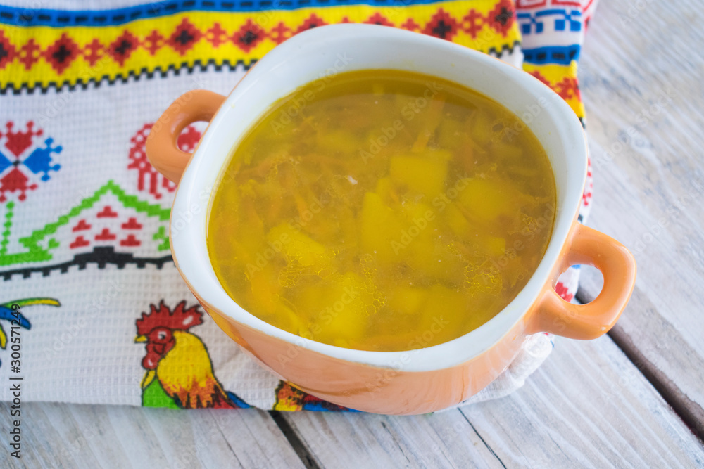 bowl of vegetable soup, rustic style bowl of vegetable soup, rustic style