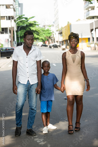 Family walking on the street photo