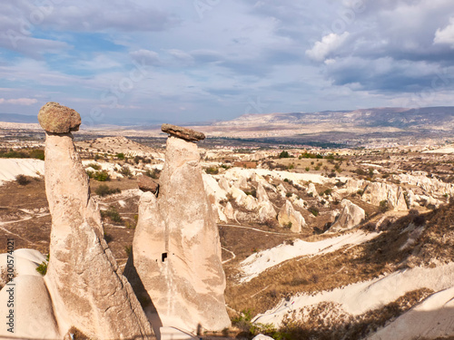 Fairy chimneys rocks at the valley near Urgup, Cappadocia, Turkey photo