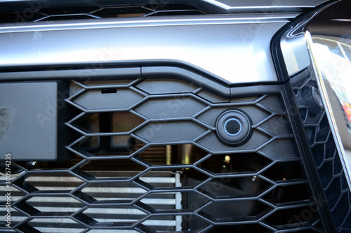 the small sensor on black grills  at the front of the pick up truck car
