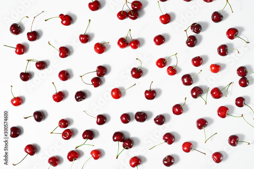 Berries of fresh ripe sweet cherry on a white surface. Top view.