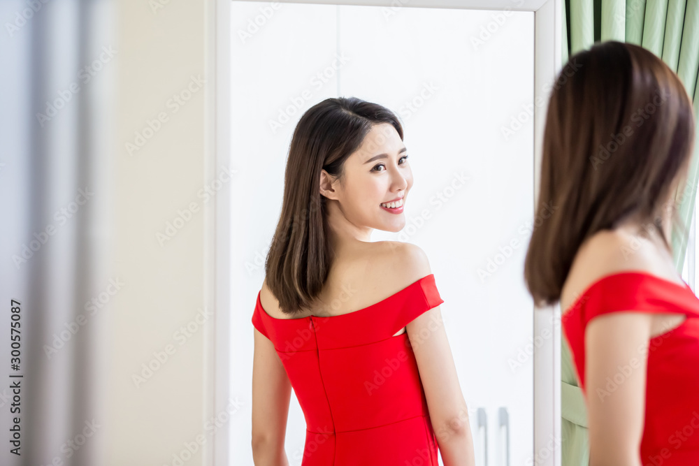 asian girl trying dress happily asian girl trying dress happily