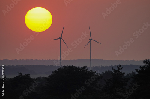 wind turbines at sunset