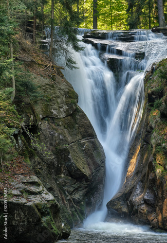 Szklarka Falls in super green forest surroundings  Karkonoski National Park  Poland