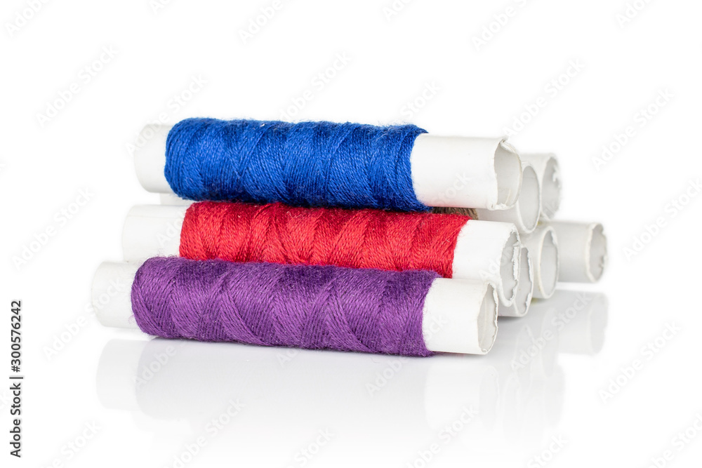 Group of eight whole sewing thread spool heap isolated on white background Group of eight whole sewing thread spool heap isolated on white background