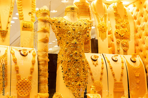 Photography Golden jewelry at the gold street Deira market, also called Gold souk, in the ci