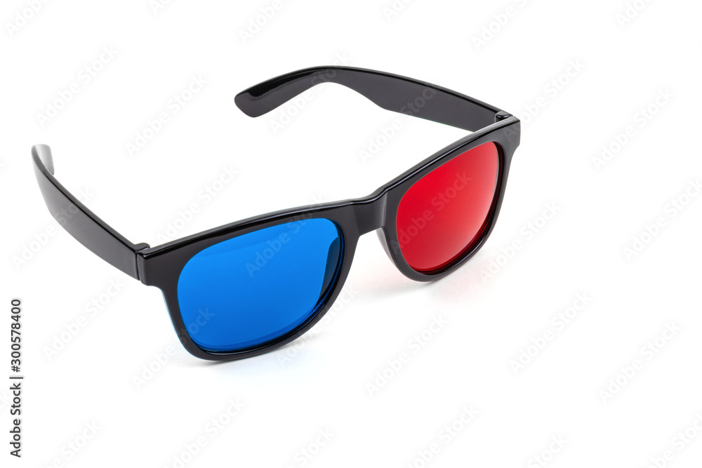 3D plastic glasses isolated on white look sideways / anaglyph glasses lie on rims with open earhooks 3D plastic glasses isolated on white look sideways / anaglyph glasses lie on rims with open earhooks