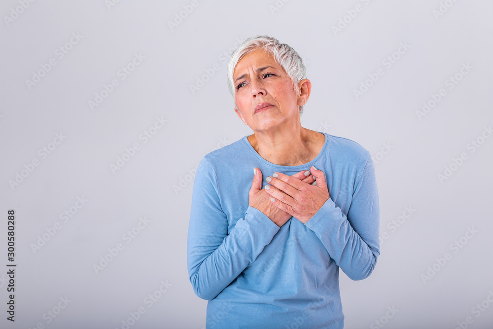 Woman having a pain in the heart area. Heart Attack. Painful Chest. Health Care, Medical Concept. High Resolution. Woman having heart attack at home Woman having a pain in the heart area. Heart Attack. Painful Chest. Health Care, Medical Concept. High Resolution. Woman having heart attack at home