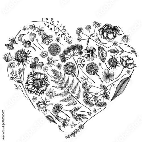 Heart floral design with black and white shepherd's purse, heather, fern, wild garlic, clover, globethistle, gentiana, astilbe, craspedia, lagurus, black caraway, chamomile, dandelion, poppy flower