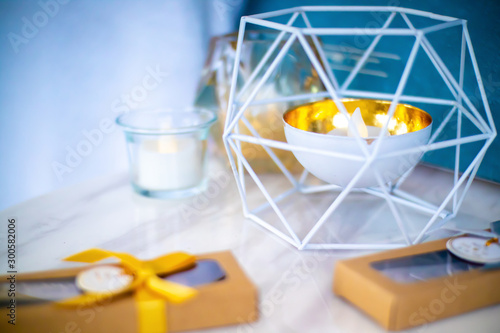 Electric candle in a cup and surrounding with wired cage